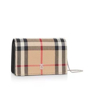 Burberry mini wallet on a chain.